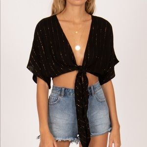 Short sleeve wrap top in black with gold stripes